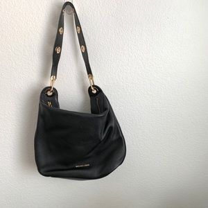 Michael Kors black tote with gold embellishments